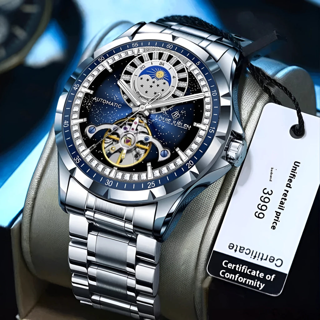 Silver men's automatic watch with a blue dial and stainless steel strap on a wrist