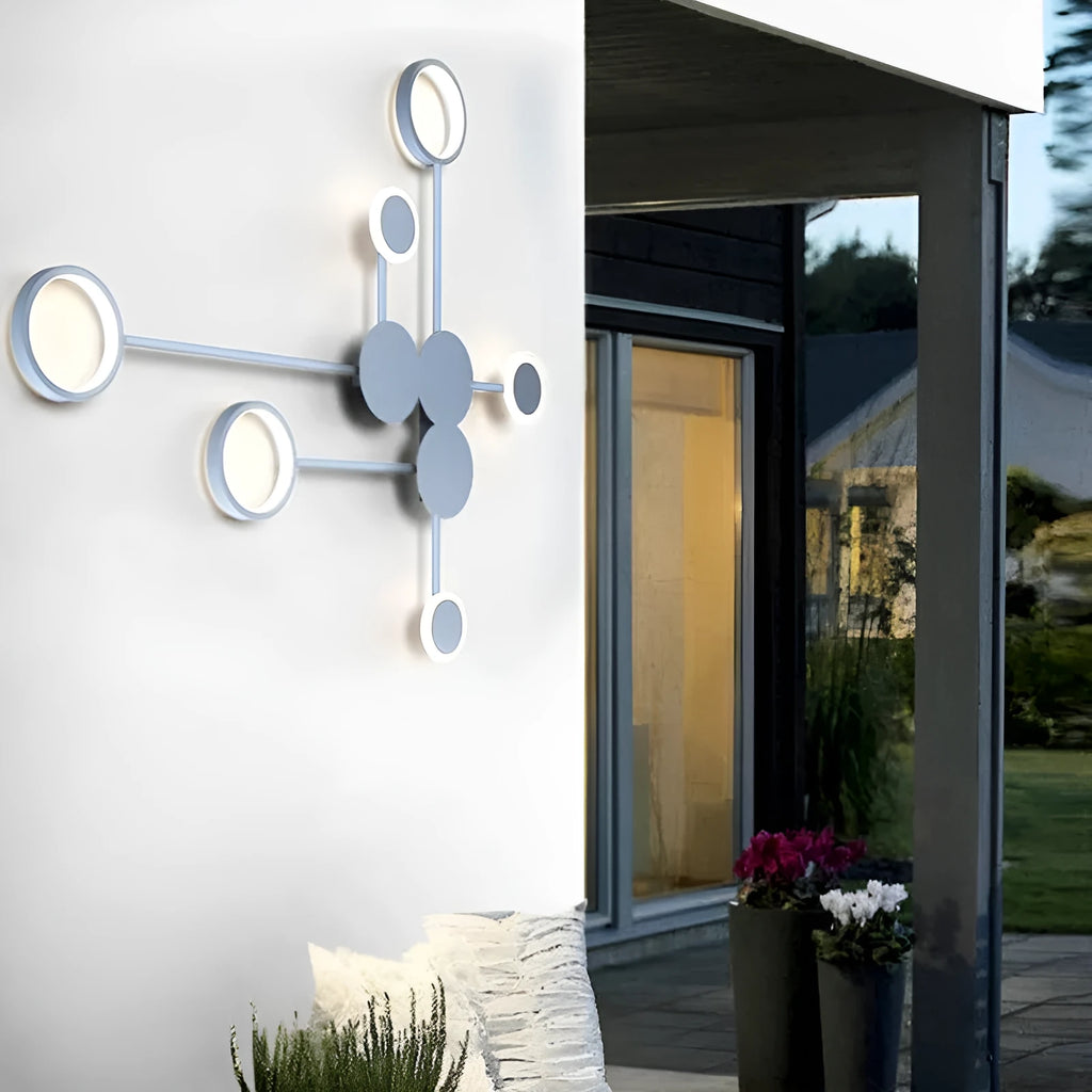 Contracted designer wall lamp with 6 heads in black iron and acrylic mounted on a bedroom wall
