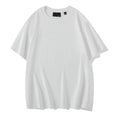 Man wearing a loose-fitting solid colour cotton t-shirt with drop-shoulder sleeves.