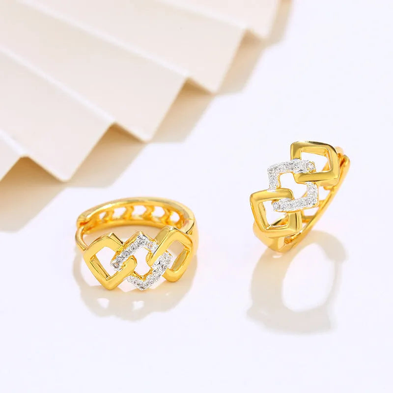 A pair of gold-coloured geometric alloy earrings with a hollow-out design.