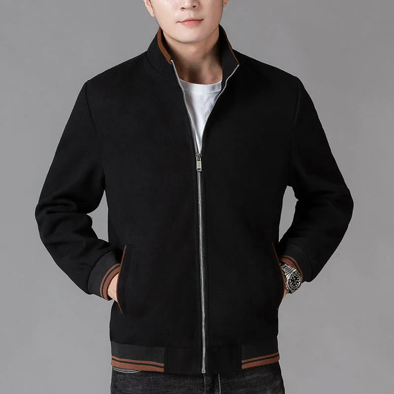 Men's grey polyester fleece sports coat with long sleeves and side pockets.