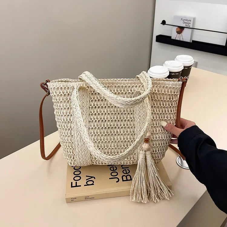 Women's straw woven crossbody shoulder bag showing diagonal weave pattern in milky white colour