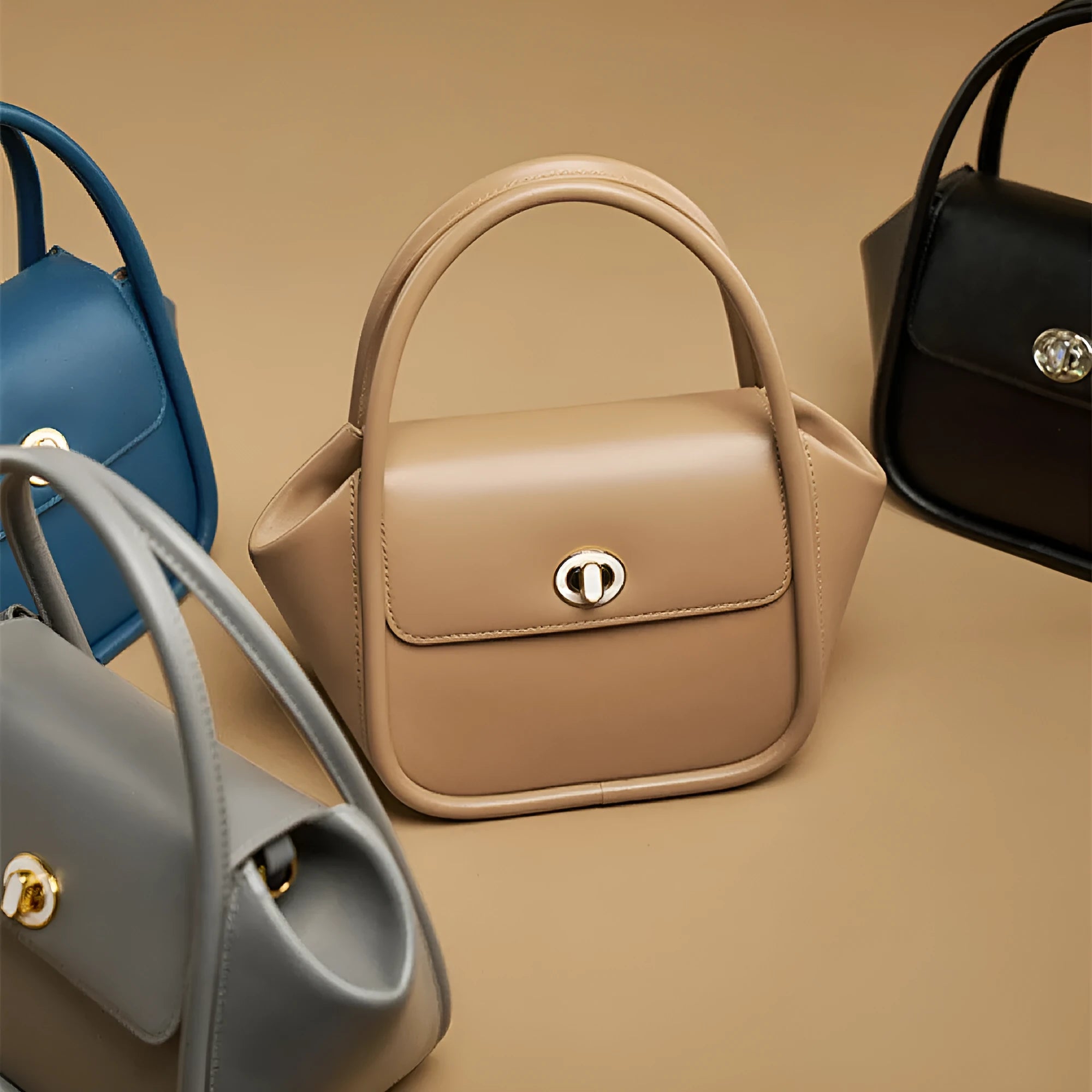 Women's leather wing tote bag in cow leather with buckle detail and cross-body strap