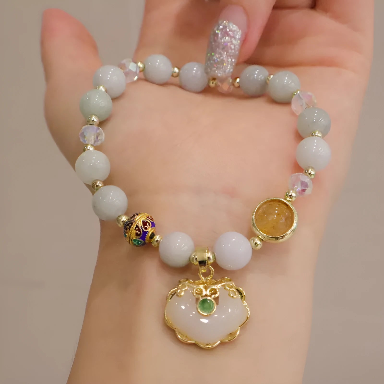 Women's geometric bracelet with grey jade and strawberry quartz options featuring three-dimensional metal ethnic decoration
