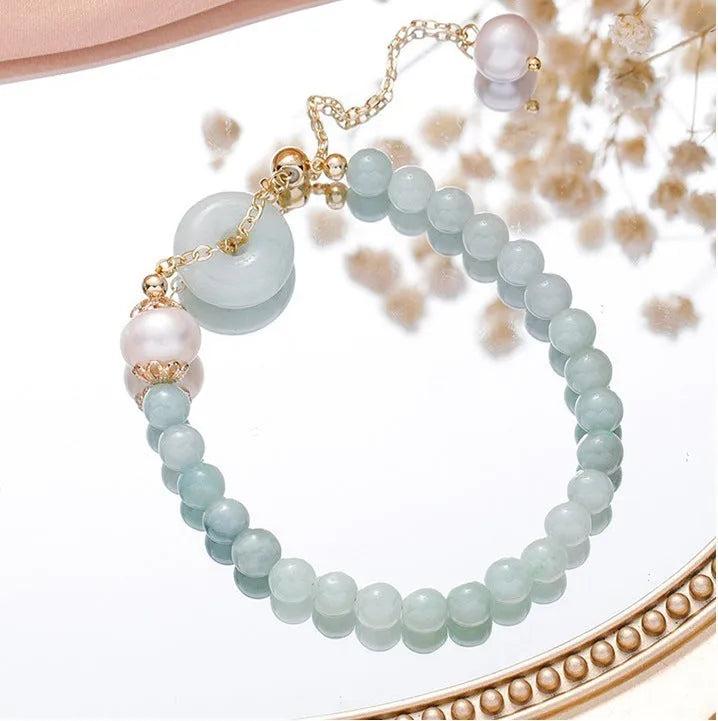 Women's Korean style crystal bracelet with choice of jade pendant, strawberry quartz, or spodumene purple styles and various buckle types.