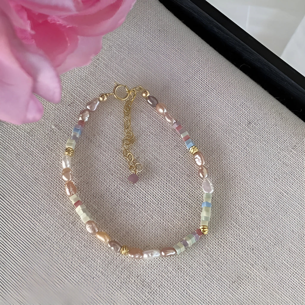 Women's natural pearl bracelet and necklace set with silver pearls and gilded purple 14K plating.