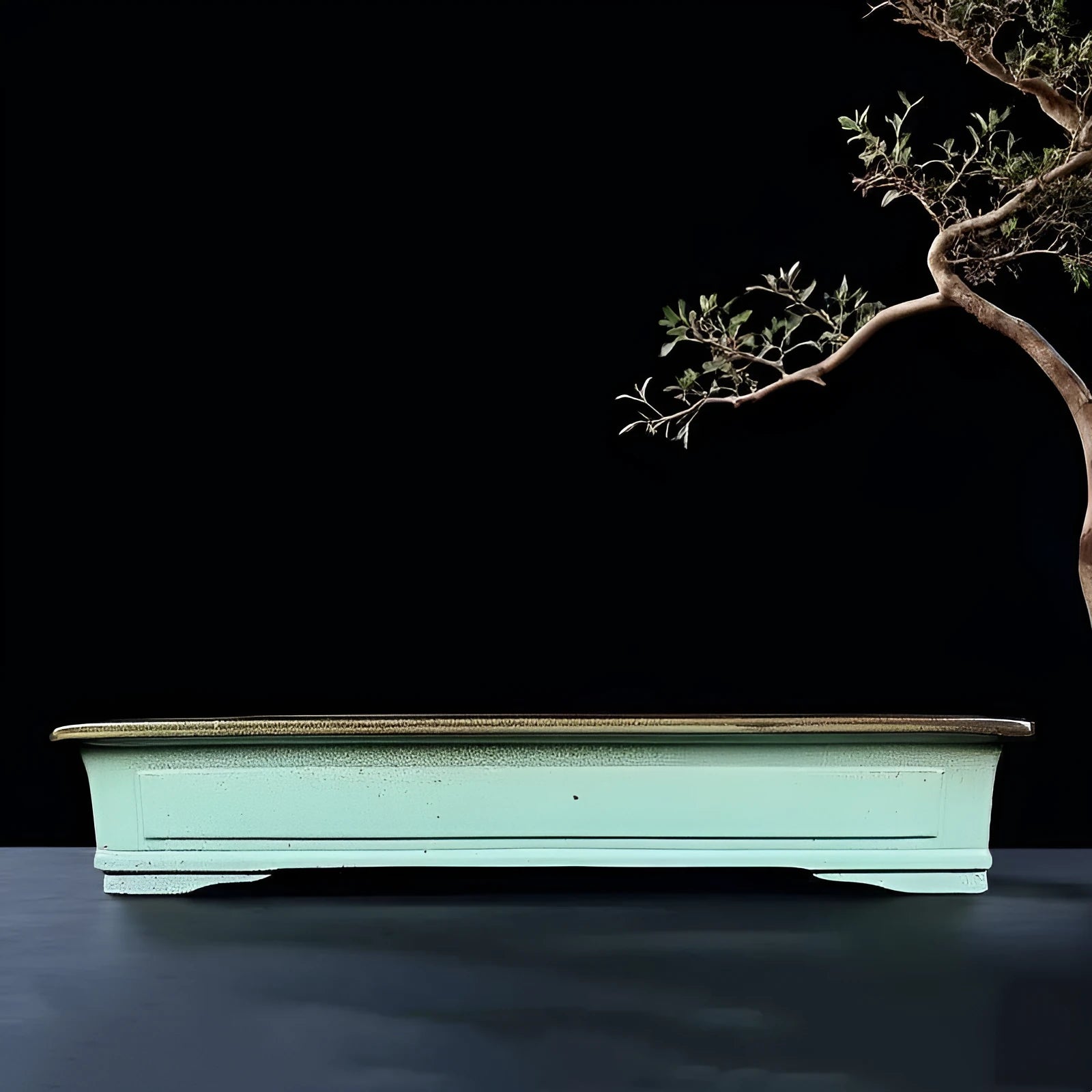 Green handmade ceramic bonsai flower pot with a retro purple sand crackled glaze.