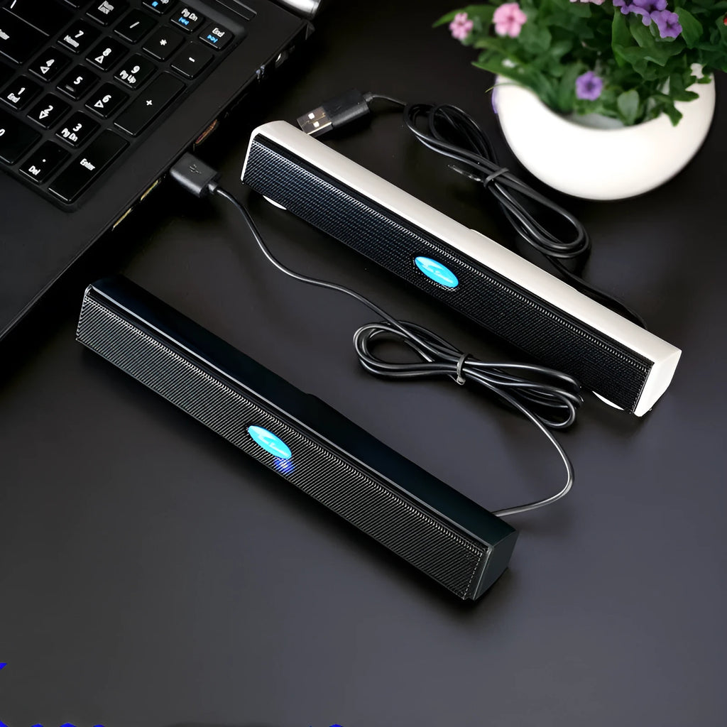 Black USB wired mini speaker for laptop computer with 200x28x27mm size and 900mm cable on a desk