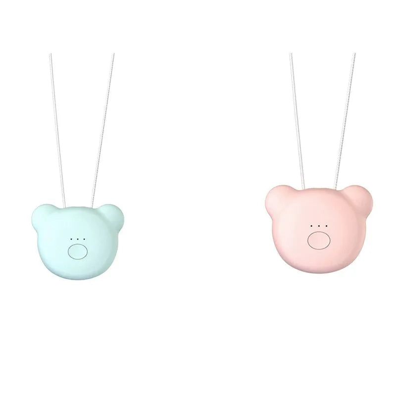 Mini USB portable air purifier necklace in pink, showing compact size and wearable design.