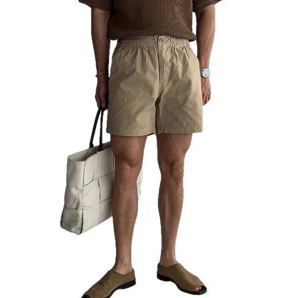 Men's cotton loose fit sports shorts in black, white, and khaki colours for summer athletic wear