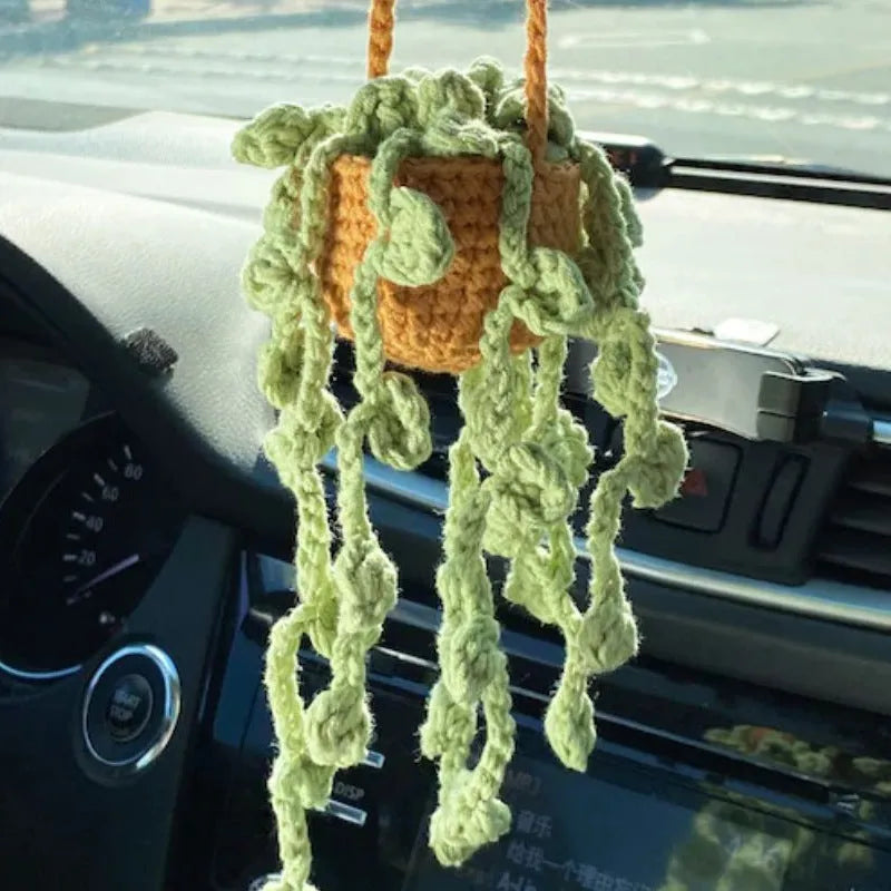 Green and white knitted wool car plant decoration with basin base and hanging rope