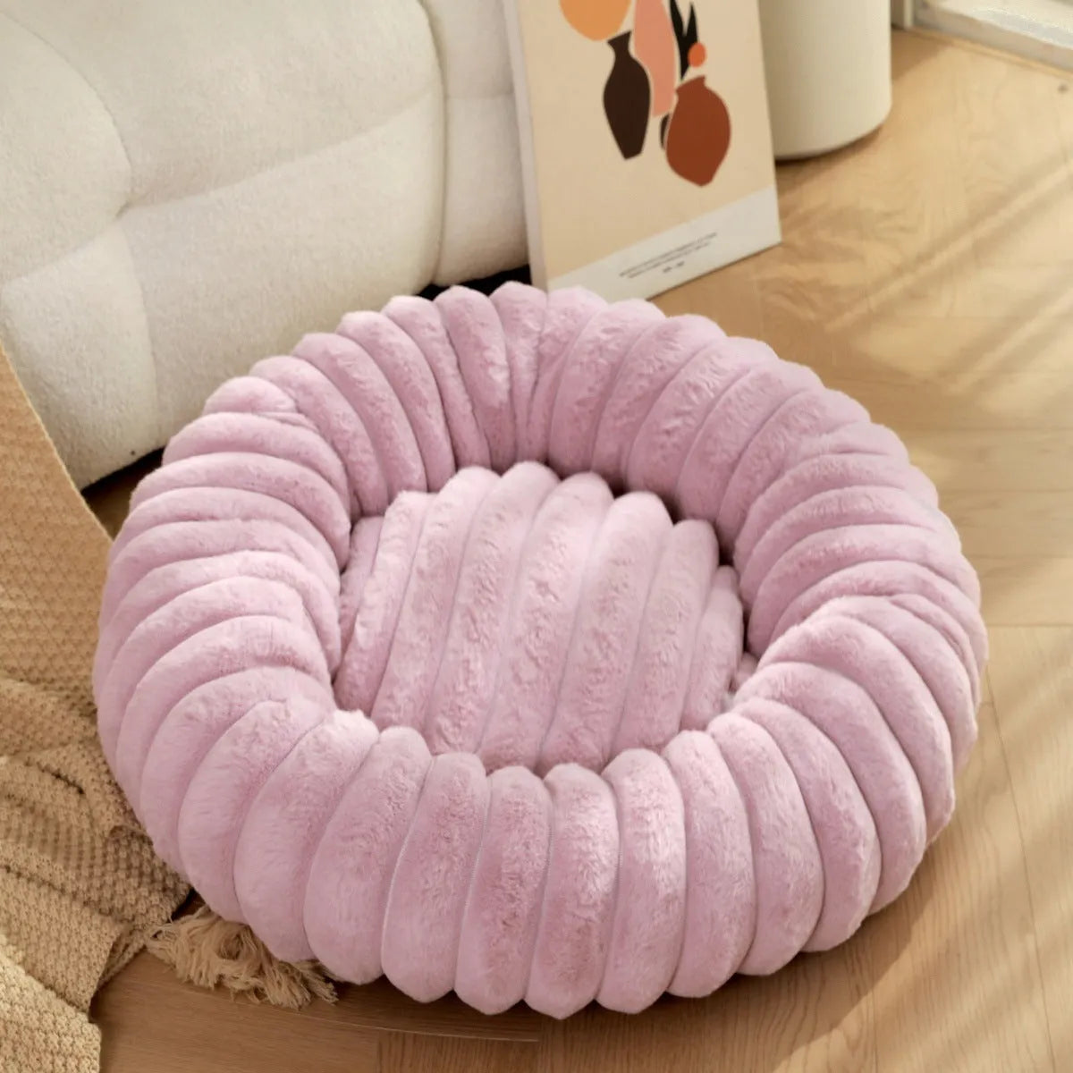Round plush pet bed with long-hair rabbit fur style texture in beige colour