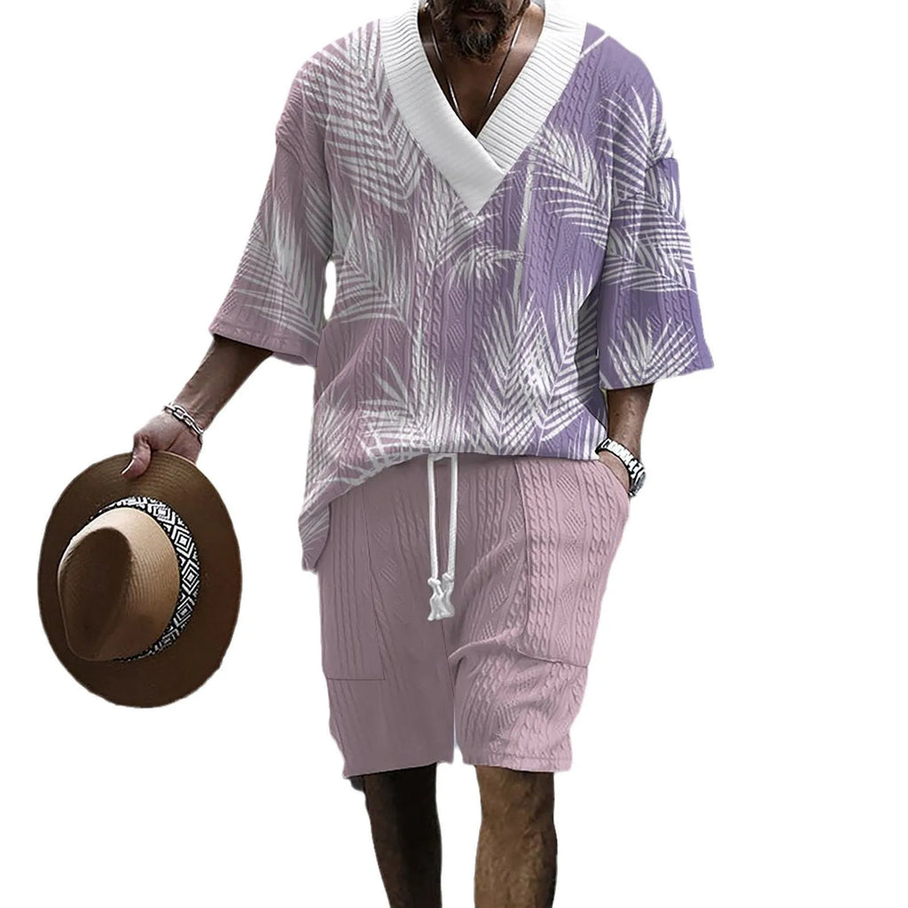 Man wearing a printed drop-shoulder knitted short-sleeve top with matching shorts.
