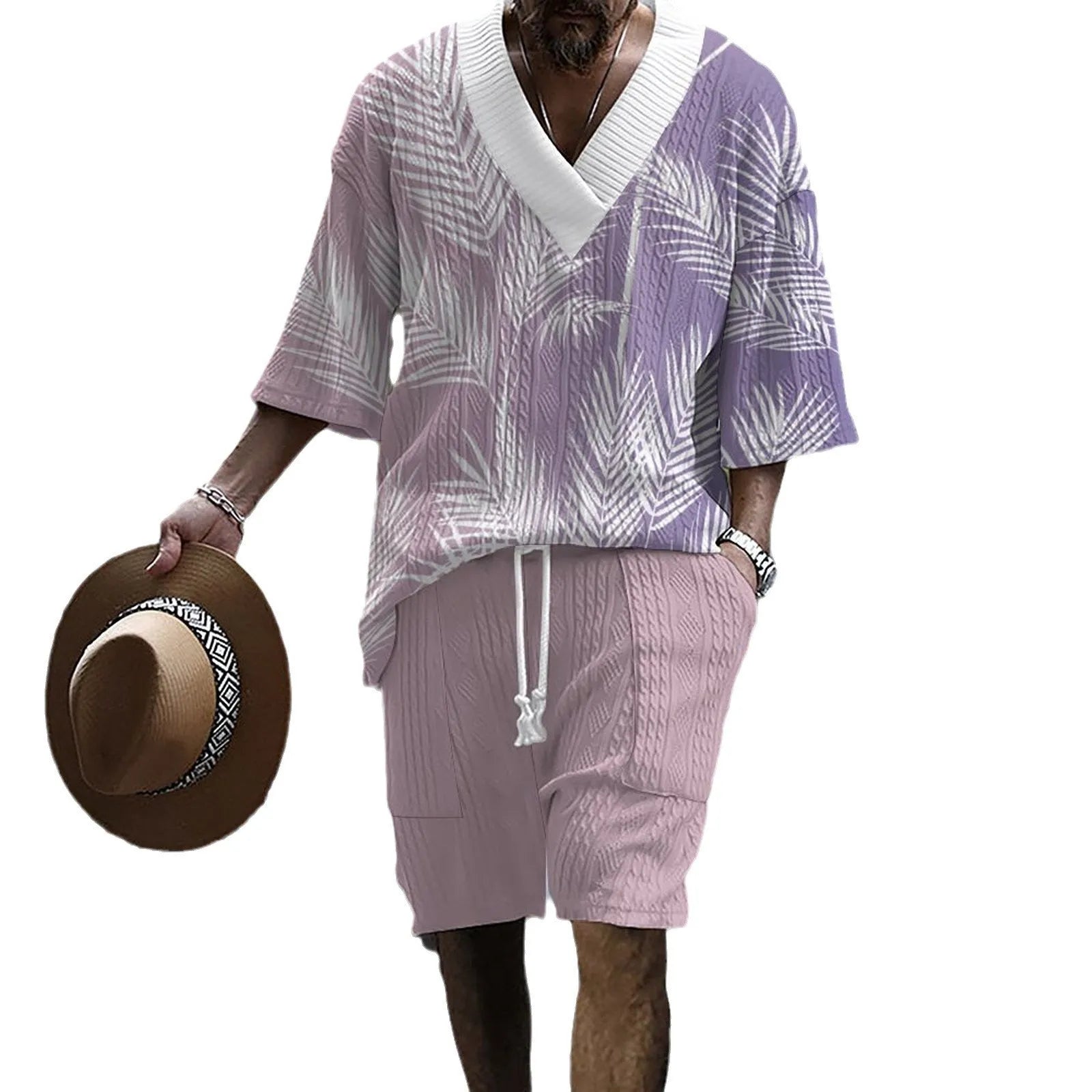 Man wearing a printed drop-shoulder knitted short-sleeve top with matching shorts.