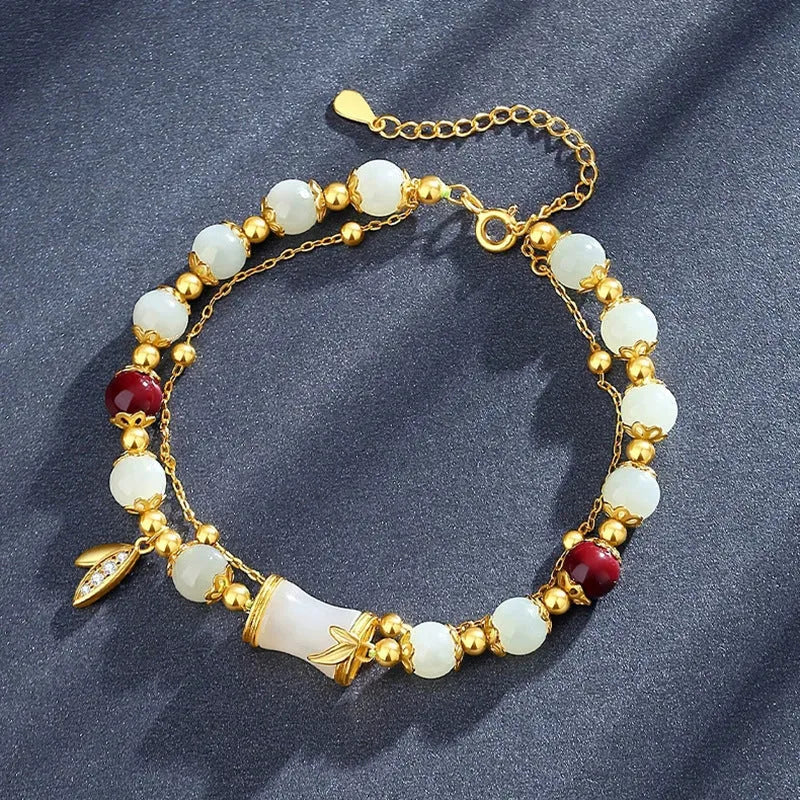 Bamboo-themed glass bracelet with coloured glaze beads and electroplated flower charm
