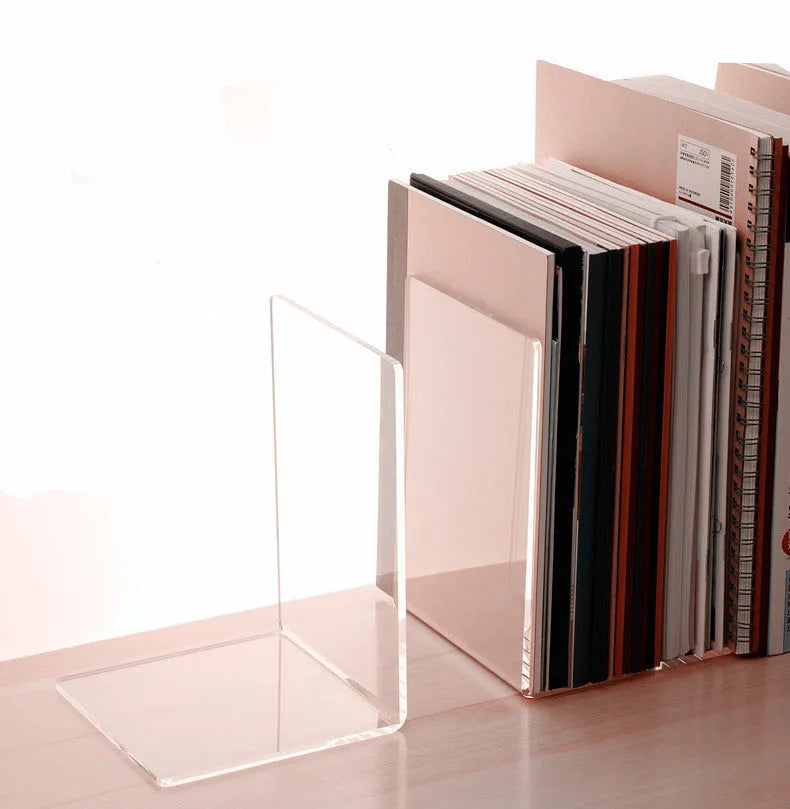 Clear transparent acrylic bookshelf holding a pair of books on a desk.
