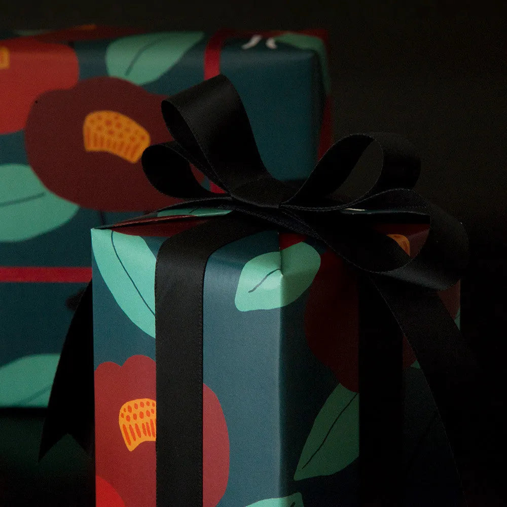 Green fixed tray gift box with camellia motif, waterproof wrapping paper, and black ribbon detail