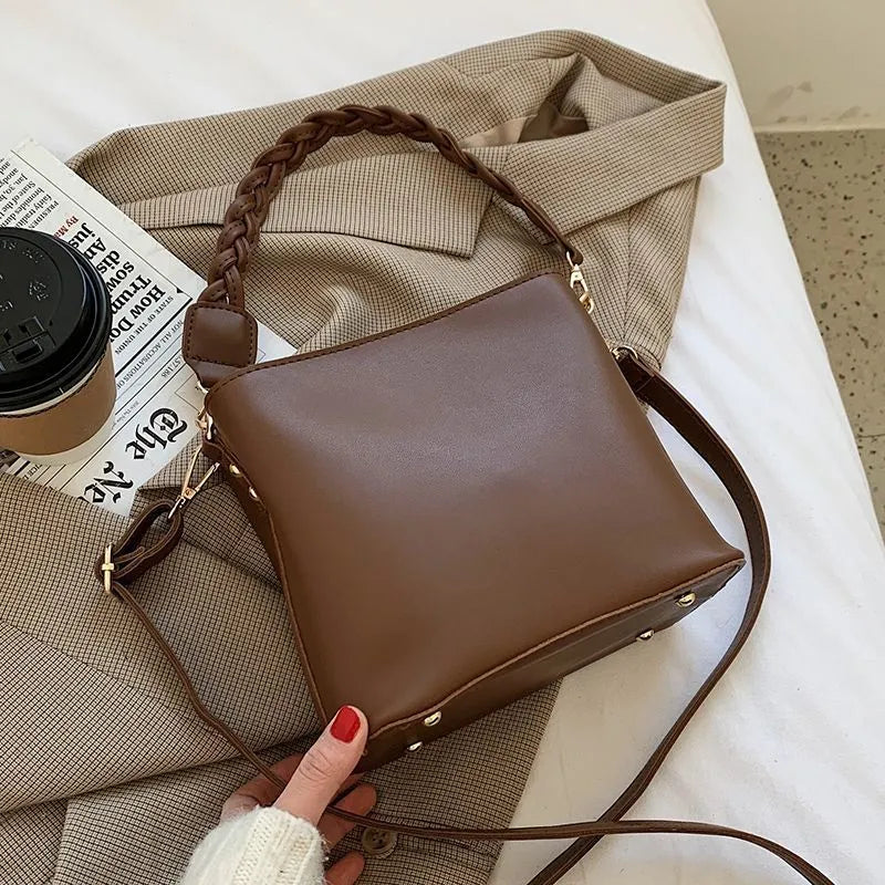 Khaki women's crossbody bucket bag with woven front texture and adjustable long strap