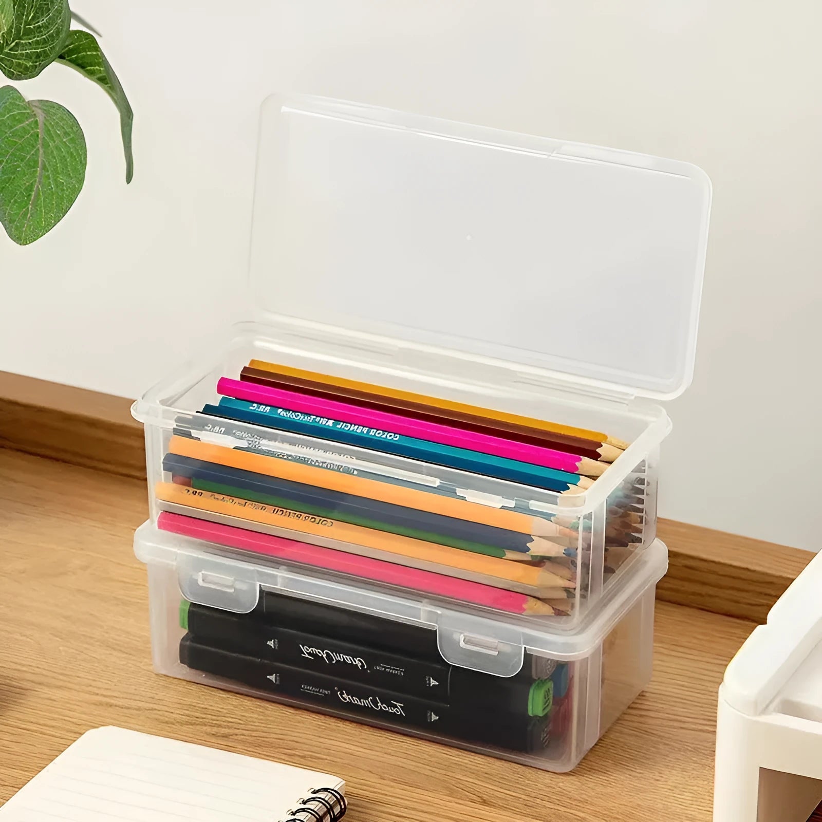 Large transparent pencil storage box with compartments for organising coloured pencils and drawing materials