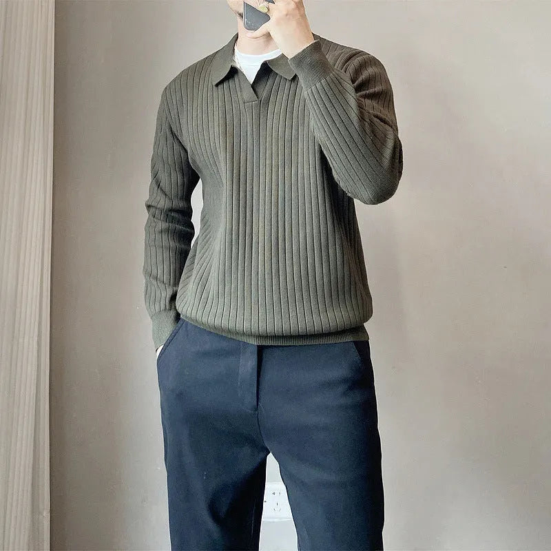 Man wearing a loose grey modal knit pullover sweater with a textured rabbit fur blend fabric.