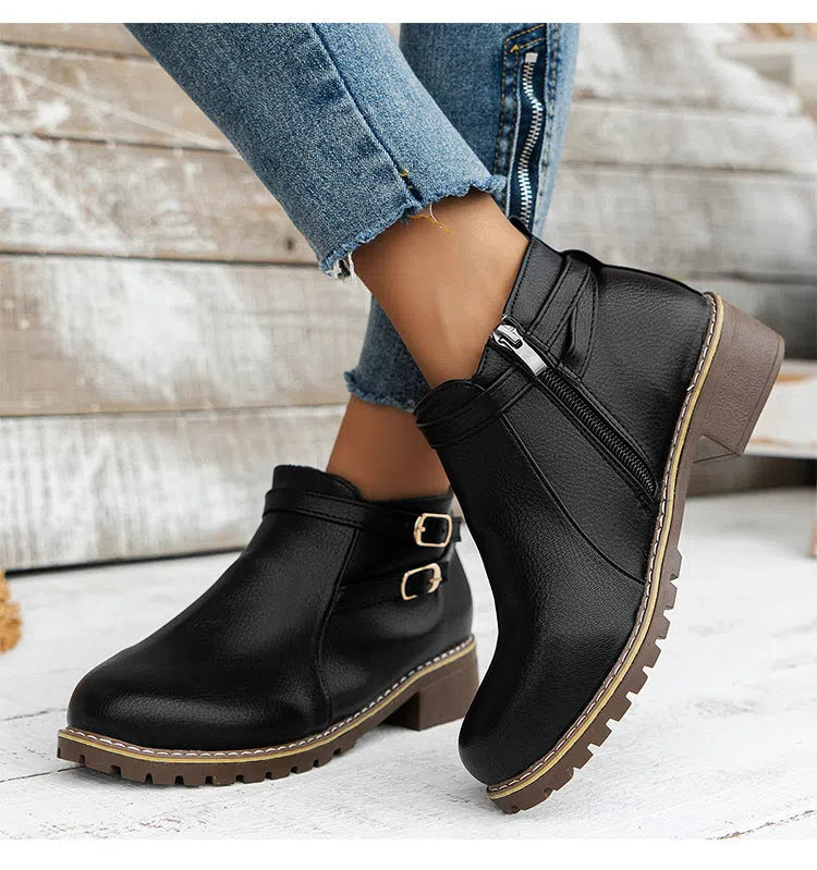 Women's low-heeled ankle boots with belt buckle, round toe, chunky heel, side zipper, in black synthetic PU leather