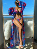 Women's long sleeve bikini swimsuit set with banded briefs and a matching robe in blue.