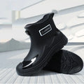 Adult low-cut waterproof wellington boots in PVC with an integrated moulded sole, shown in khaki colour.