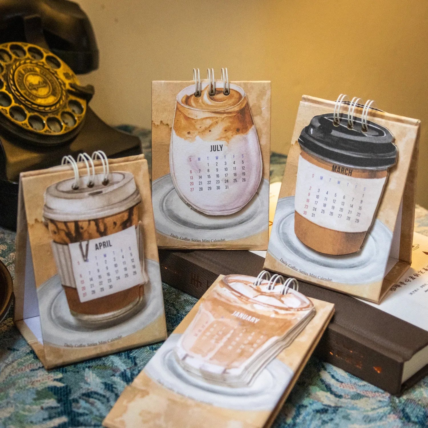 Mini desk calendar 2025 with four themed paper designs including coffee time model