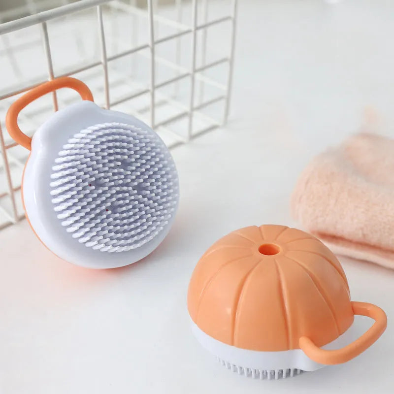 Orange silicone dog bath brush with shampoo dispenser and soft TPR bristles for pet grooming