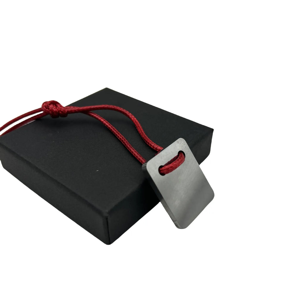 Silver-coloured metal car paint repair scraper tool for vehicle scratch and dent touch-ups.