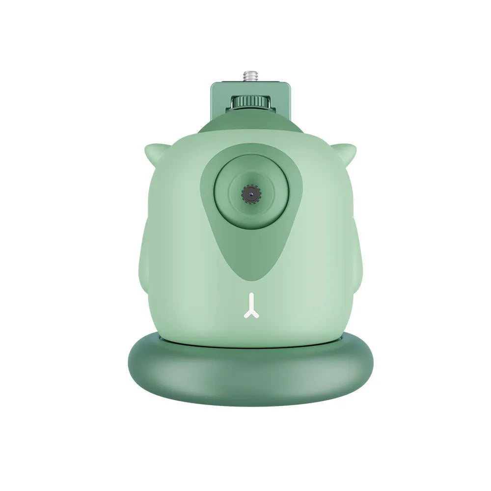 Dark green intelligent AI tracking gimbal with 360 rotation on a desktop.