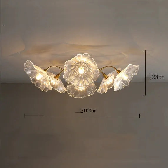 Modern creative ceiling chandelier with five white flower heads and warm lighting.