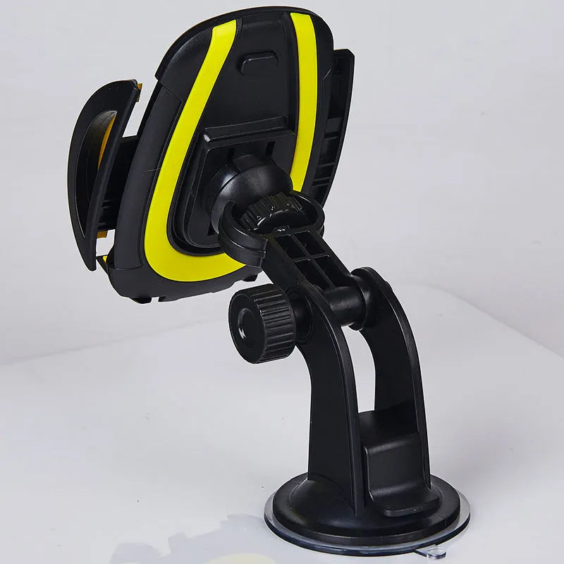 Blue suction cup U-shaped car phone holder mounted on a dashboard holding a mobile phone.