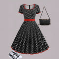 Multicolour polka dot dress with a square neckline, short sleeves, and a full pleated skirt with a back zip.