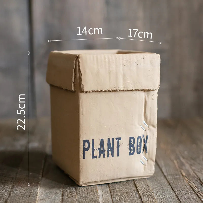 Cement flowerpot in Nordic style with bottom drainage holes on a floor