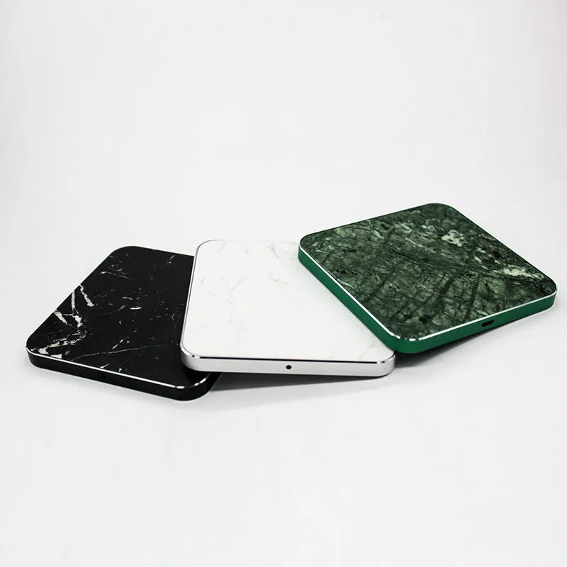 Real marble wireless charger with aluminium alloy base on desk showing indicator light