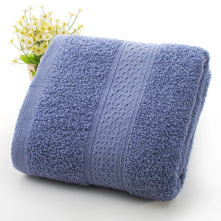 Thick bath and beach towels in seven colour options including apple green, dark blue, and light pink