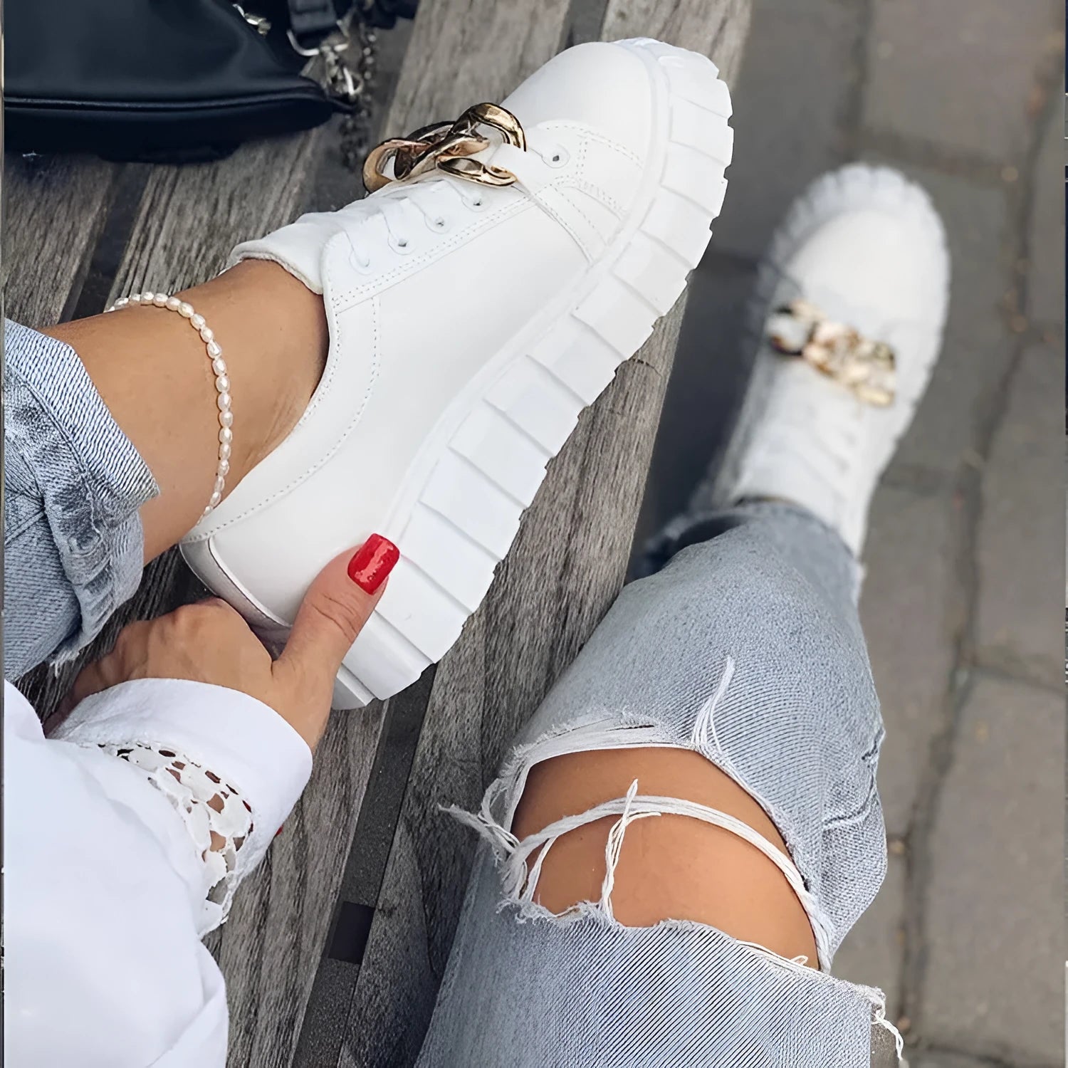 Low-top flat casual sneakers in artificial PU with rubber sole and front lace closure