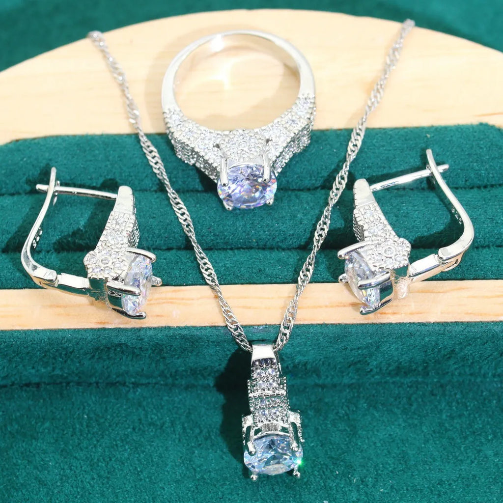 Bridal zircon necklace, bracelet, earrings, and ring four-piece jewellery set in alloy.