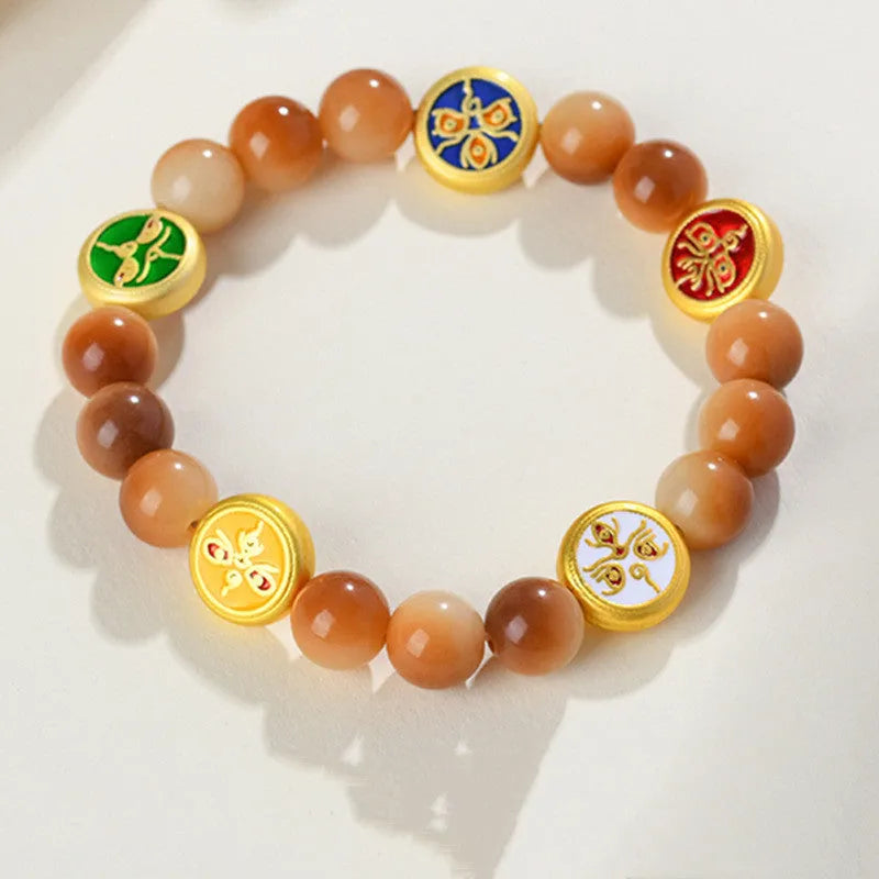 Yellow bodhi seed bracelet with geometric shapes measuring 14-17 inches