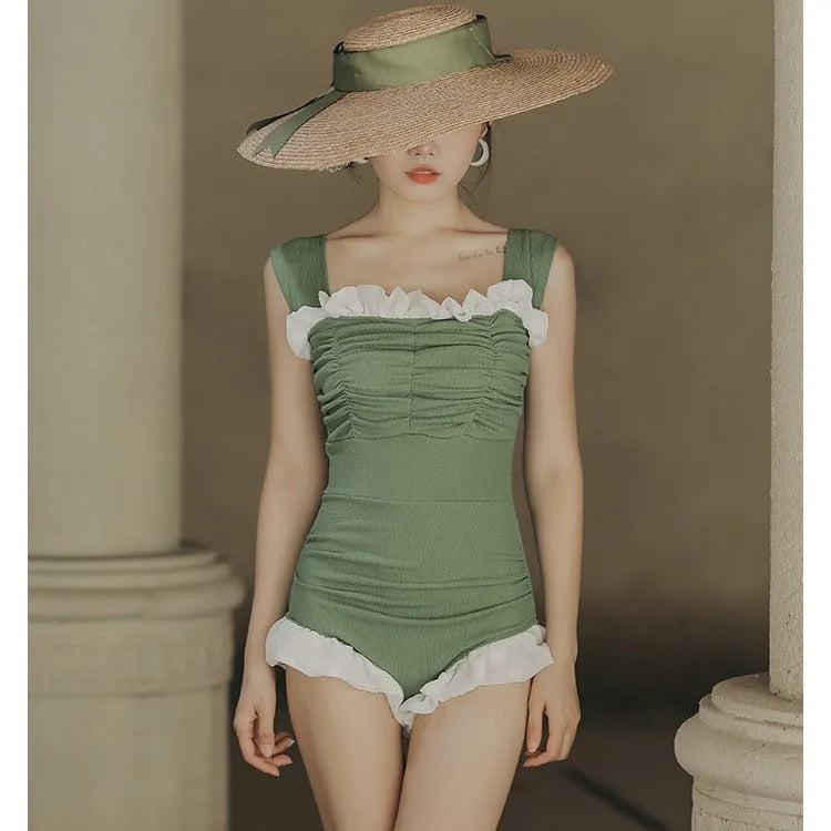 Korean-style high-waist one-piece swimsuit in black, pink, or green on a model
