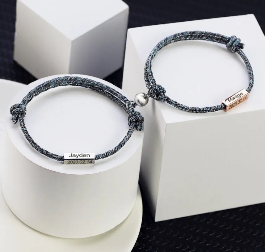 Pair of stainless steel magnetic bracelets for couples, silver and rose gold finish, with adjustable hand rope
