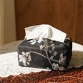 New Chinese style white brocade tissue box cover with embroidered plum blossoms on a table.