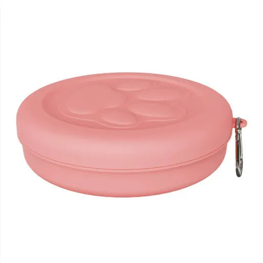 Collapsible silicone dog bowl in pink and green colours, shown in both open and flattened positions.