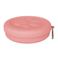 Collapsible silicone dog bowl in pink and green colours, shown in both open and flattened positions.