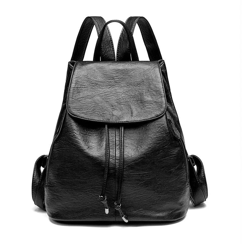 Soft black genuine leather women's backpack in Korean street trend style, showing multiple internal compartments.