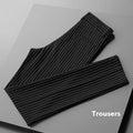 Man wearing thin striped loose-fit casual trousers in a drape style, shown in black and white colour options.