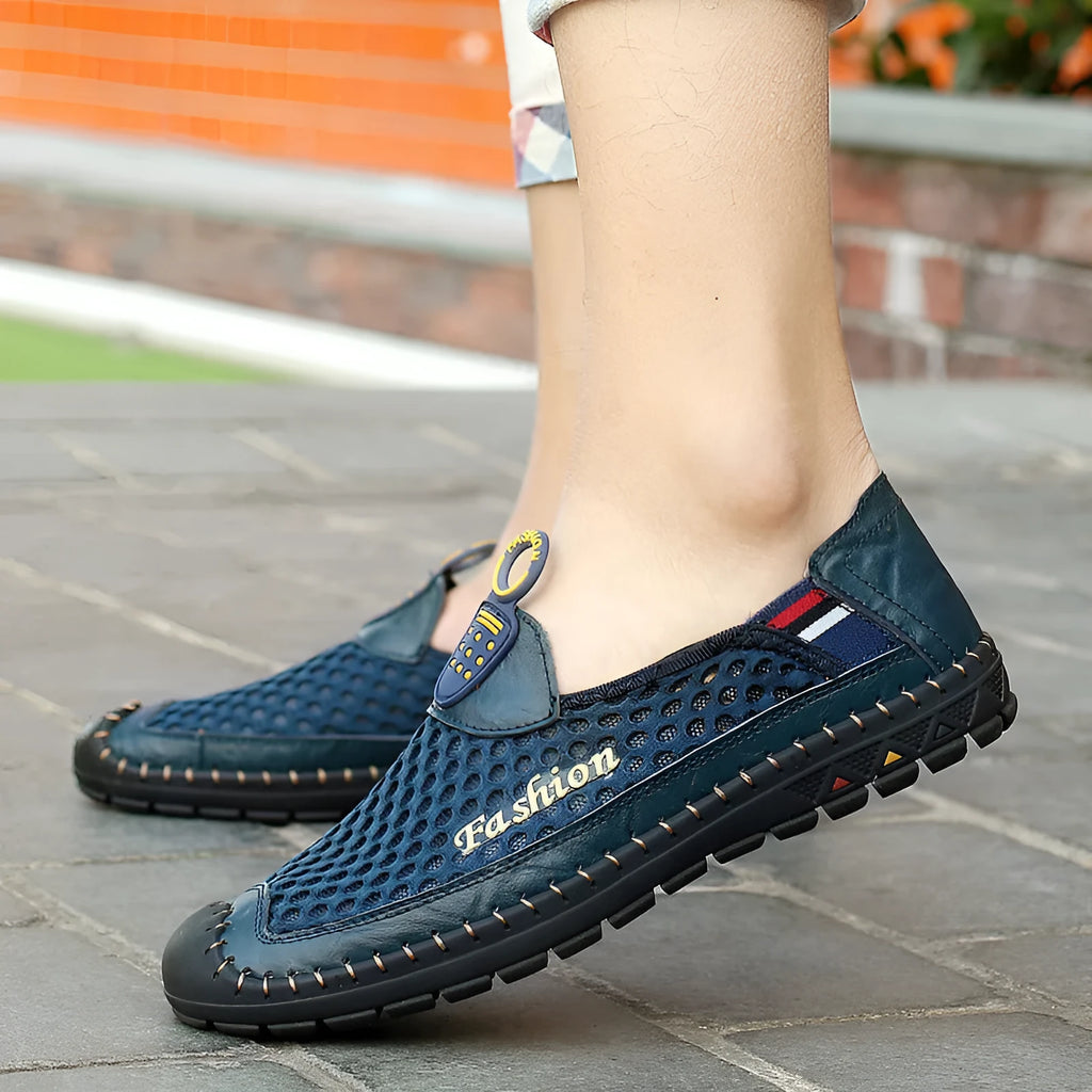 Men's brown casual mesh shoes with a round toe and non-slip rubber sole on a plain background.