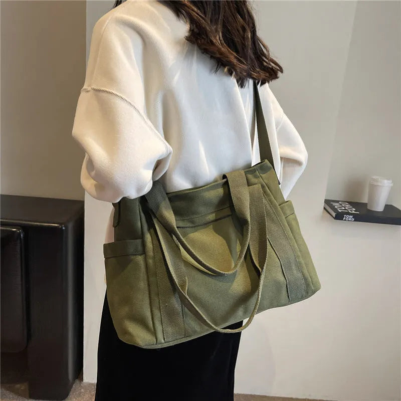 Large capacity polyester canvas shoulder tote bag with internal phone compartment in solid colour
