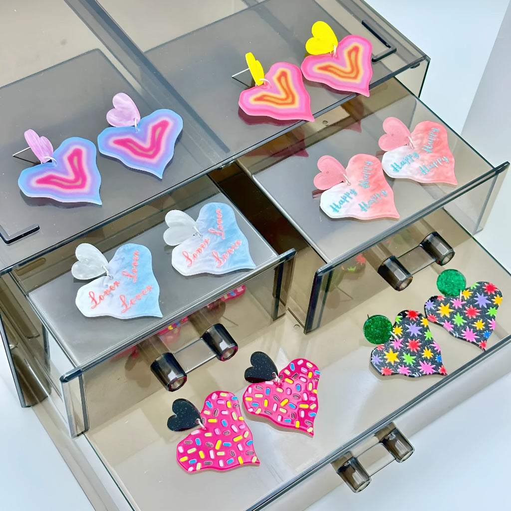 Color printing love heart acrylic earrings in six sweet styles A-F on white background
